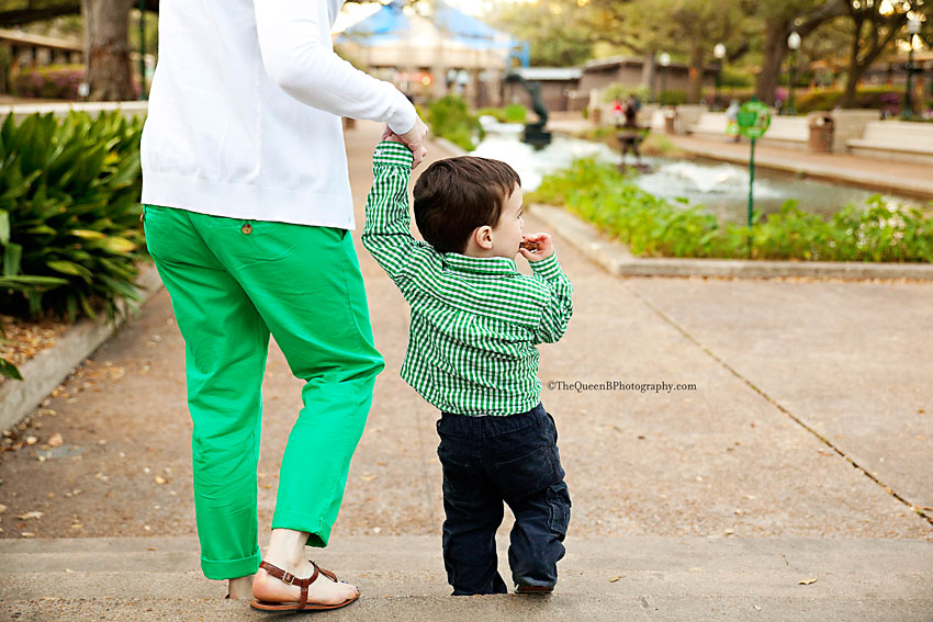 toddler boy holding hands with mom