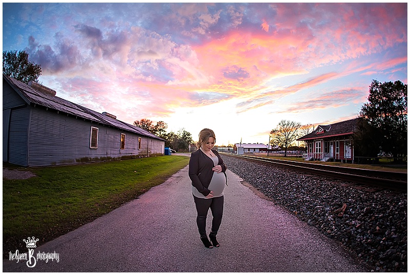 gorgeous sunset maternity portrait by barn and railroad tracks