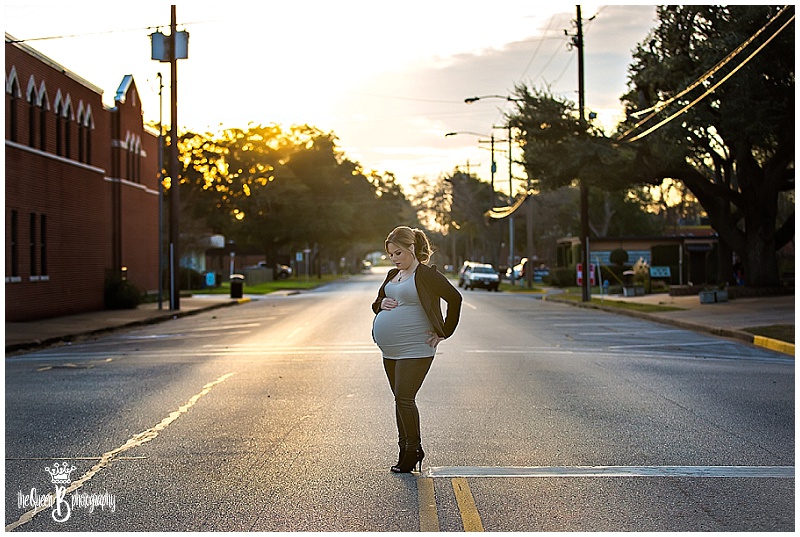 Sunset maternity portrait on small town Texas road