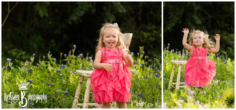 silly toddler girl playing among Houston bluebonnet flowers