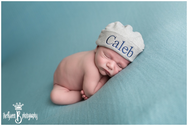 sleeping newborn boy wearing slouchy hat