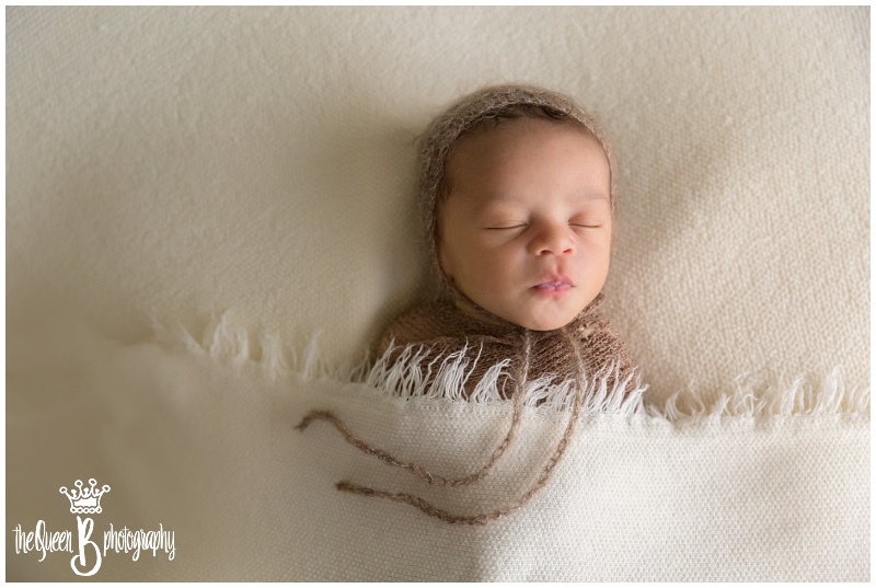 Sugar Land Newborn Photographer captures beautiful baby boy sleeping under blanket