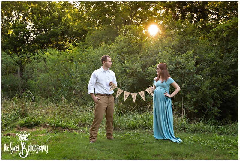 Sunset Maternity Portraits | Couple in the woods with Burlap Banner
