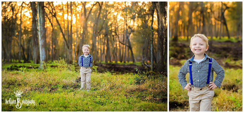 little boy in blue suspenders at sunset in the woods