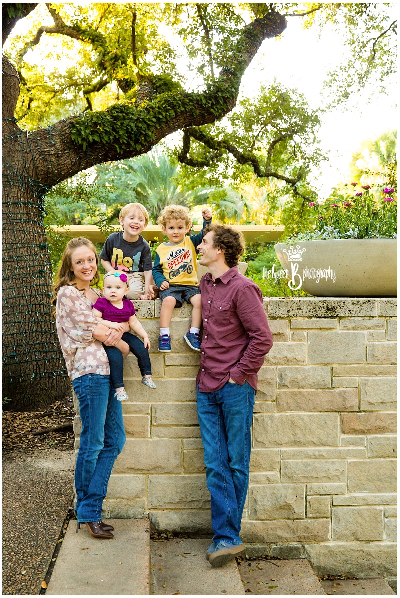 Fun family of five laughing during family photo shoot