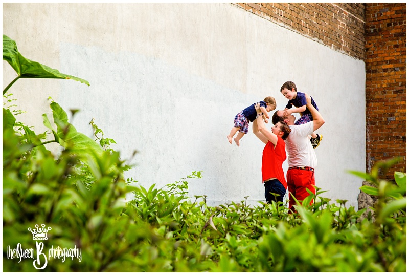 parents lifting little boys in the air during Houston Family photo session
