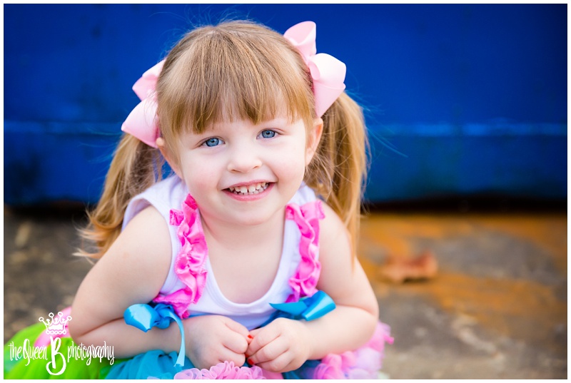 Houston Child Photographer captures adorable girl in pigtails in urban location