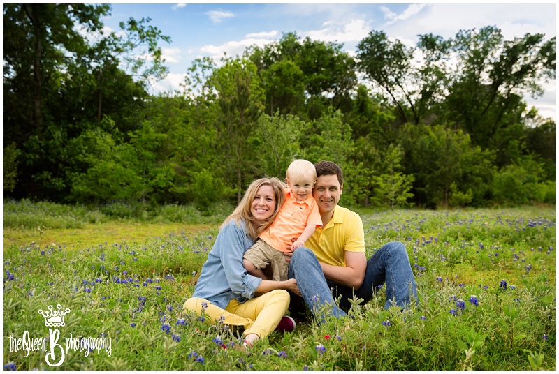 fun family playing in field of texas wildflowers