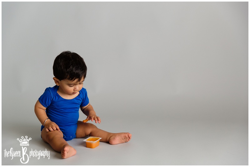 Baby boy investigating sweet potato baby food